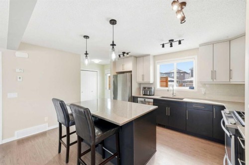 157 Fireside Circle Nw, Cochrane, AB - Indoor Photo Showing Kitchen With Upgraded Kitchen