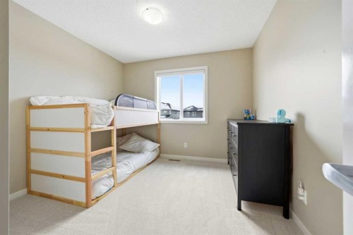 157 Fireside Circle Nw, Cochrane, AB - Indoor Photo Showing Bedroom