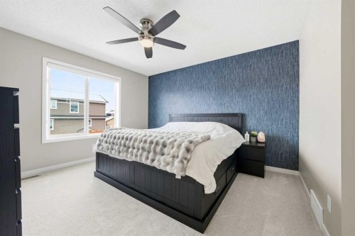 157 Fireside Circle Nw, Cochrane, AB - Indoor Photo Showing Bedroom