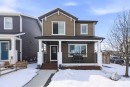 157 Fireside Circle Nw, Cochrane, AB  - Outdoor With Deck Patio Veranda With Facade 