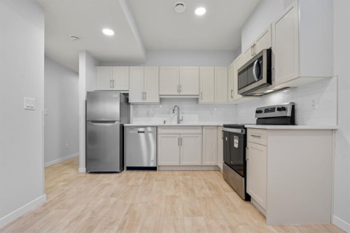 153 Edith Way Nw, Calgary, AB - Indoor Photo Showing Kitchen With Stainless Steel Kitchen