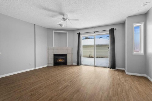 3101 39 Street Sw, Calgary, AB - Indoor Photo Showing Living Room With Fireplace