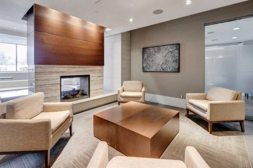 251-222 Riverfront Avenue Sw, Calgary, AB - Indoor Photo Showing Living Room With Fireplace