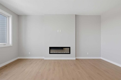 139 Belvedere Crescent Se, Calgary, AB - Indoor With Fireplace