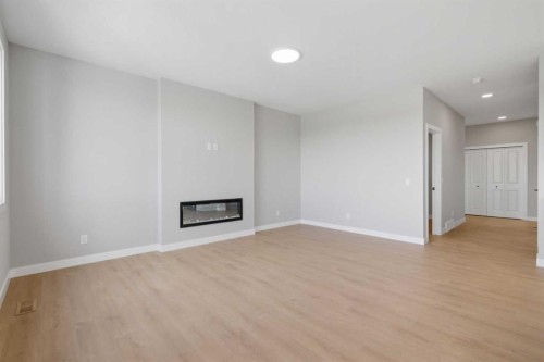 139 Belvedere Crescent Se, Calgary, AB - Indoor With Fireplace