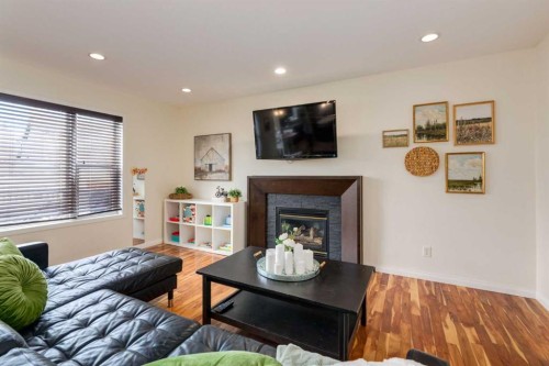 168 West Creek Pond, Chestermere, AB - Indoor Photo Showing Living Room With Fireplace