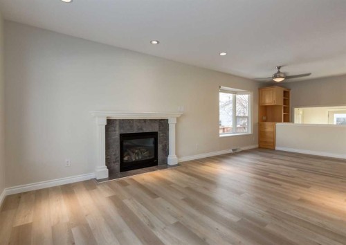 367 Acadia Drive Se, Calgary, AB - Indoor Photo Showing Living Room With Fireplace