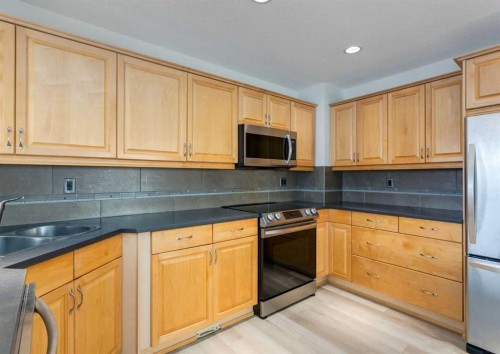 367 Acadia Drive Se, Calgary, AB - Indoor Photo Showing Kitchen With Double Sink