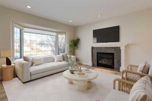 367 Acadia Drive Se, Calgary, AB - Indoor Photo Showing Living Room With Fireplace