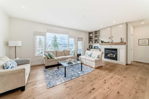 44 Eagleview Heights, Cochrane, AB - Indoor Photo Showing Living Room With Fireplace