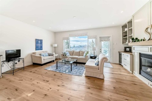 44 Eagleview Heights, Cochrane, AB - Indoor Photo Showing Living Room With Fireplace