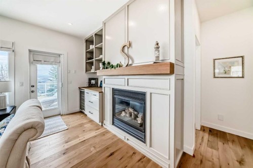 44 Eagleview Heights, Cochrane, AB - Indoor Photo Showing Living Room With Fireplace