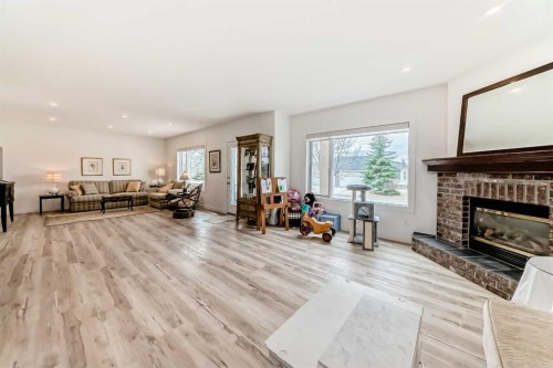 44 Eagleview Heights, Cochrane, AB - Indoor Photo Showing Living Room With Fireplace