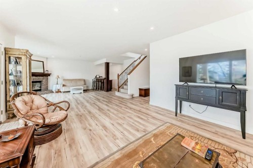 44 Eagleview Heights, Cochrane, AB - Indoor Photo Showing Other Room With Fireplace