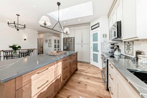 44 Eagleview Heights, Cochrane, AB - Indoor Photo Showing Kitchen With Double Sink With Upgraded Kitchen