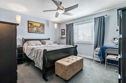 61 Drake Landing Loop, Okotoks, AB - Indoor Photo Showing Bedroom