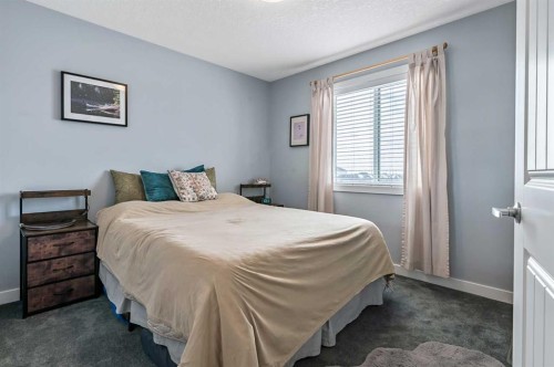 61 Drake Landing Loop, Okotoks, AB - Indoor Photo Showing Bedroom