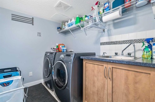 61 Drake Landing Loop, Okotoks, AB - Indoor Photo Showing Laundry Room