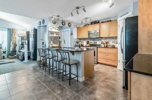61 Drake Landing Loop, Okotoks, AB - Indoor Photo Showing Kitchen With Upgraded Kitchen