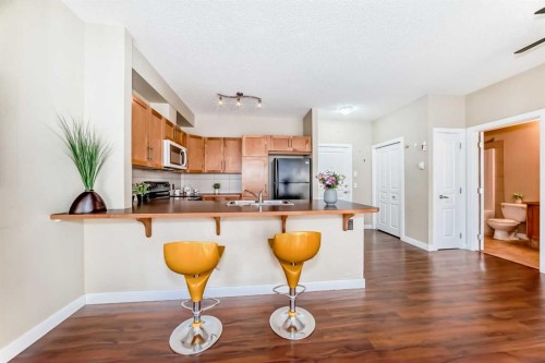 203-48 Panatella Road Nw, Calgary, AB - Indoor Photo Showing Kitchen With Double Sink