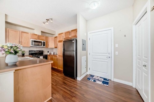 203-48 Panatella Road Nw, Calgary, AB - Indoor Photo Showing Kitchen