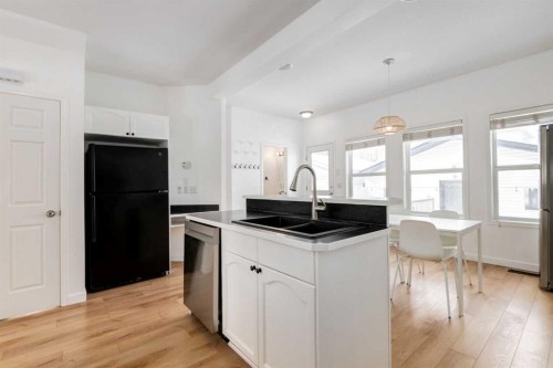 15770 Everstone Road Sw, Calgary, AB - Indoor Photo Showing Kitchen With Double Sink