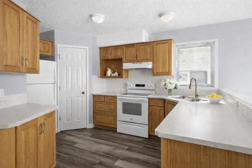 3103 39 Street Sw, Calgary, AB - Indoor Photo Showing Kitchen With Double Sink