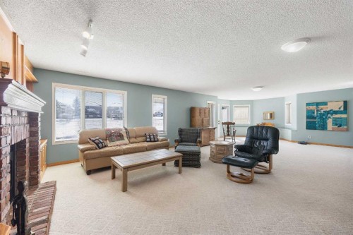 8 Edgevalley View Nw, Calgary, AB - Indoor Photo Showing Living Room With Fireplace