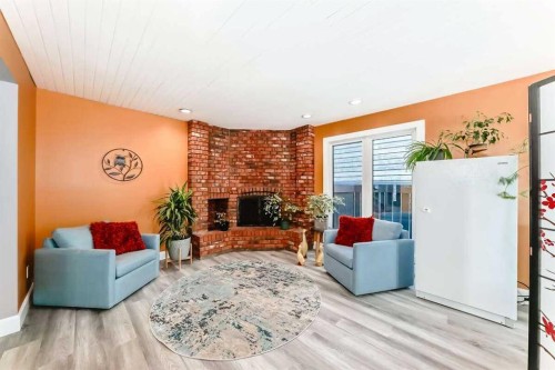 2002 Pump Hill Way Sw, Calgary, AB - Indoor Photo Showing Living Room With Fireplace