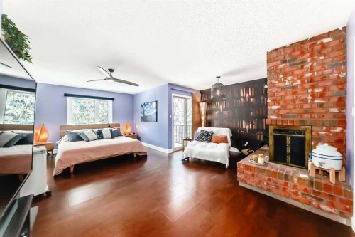 2002 Pump Hill Way Sw, Calgary, AB - Indoor Photo Showing Other Room With Fireplace