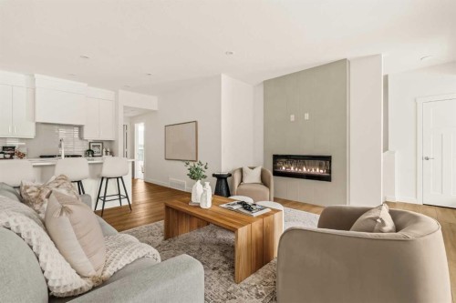 615 Sovereign Common Sw, Calgary, AB - Indoor Photo Showing Living Room With Fireplace