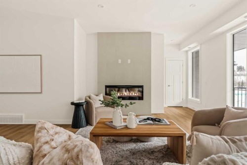 615 Sovereign Common Sw, Calgary, AB - Indoor Photo Showing Living Room With Fireplace