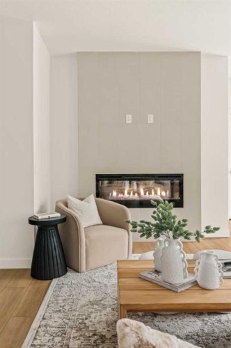 615 Sovereign Common Sw, Calgary, AB - Indoor Photo Showing Living Room With Fireplace