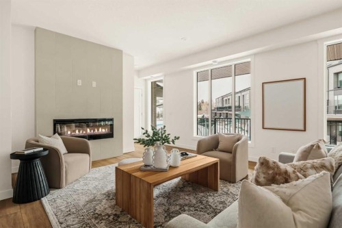 615 Sovereign Common Sw, Calgary, AB - Indoor Photo Showing Living Room With Fireplace