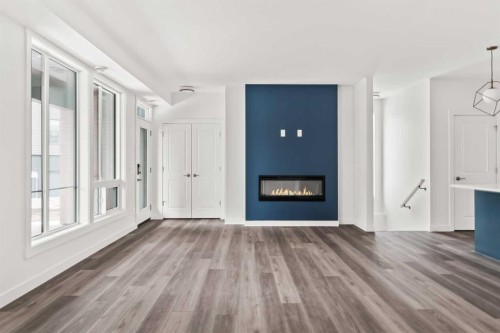 605 Sovereign Common Sw, Calgary, AB - Indoor Photo Showing Other Room With Fireplace