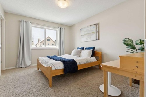 63 Walden Drive Se, Calgary, AB - Indoor Photo Showing Bedroom