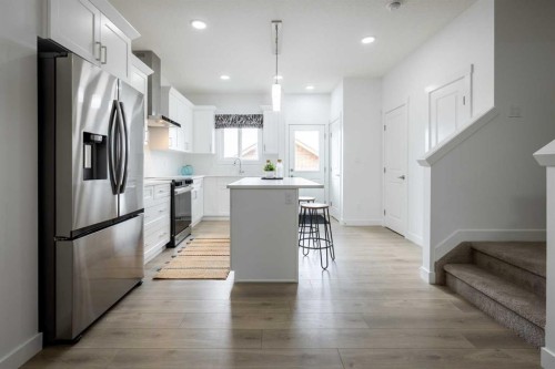 48 Andalusian Road, Cochrane, AB - Indoor Photo Showing Kitchen With Upgraded Kitchen