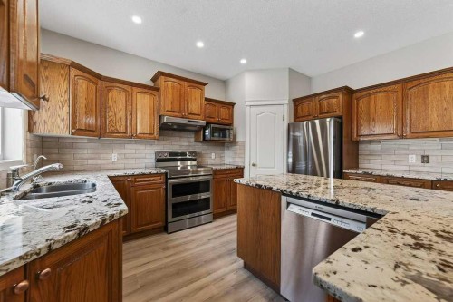 137 Simcrest Heights Sw, Calgary, AB - Indoor Photo Showing Kitchen With Stainless Steel Kitchen With Double Sink