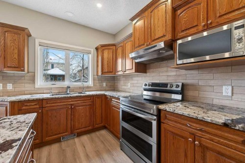 137 Simcrest Heights Sw, Calgary, AB - Indoor Photo Showing Kitchen With Stainless Steel Kitchen With Double Sink