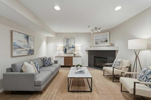 137 Simcrest Heights Sw, Calgary, AB - Indoor Photo Showing Living Room With Fireplace