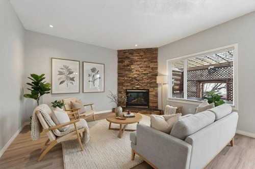 137 Simcrest Heights Sw, Calgary, AB - Indoor Photo Showing Living Room With Fireplace