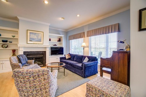 8 Link Spur, Claresholm, AB - Indoor Photo Showing Living Room With Fireplace
