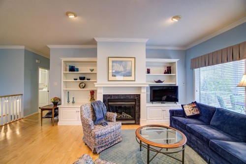8 Link Spur, Claresholm, AB - Indoor Photo Showing Living Room With Fireplace