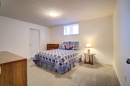 8 Link Spur, Claresholm, AB - Indoor Photo Showing Bedroom