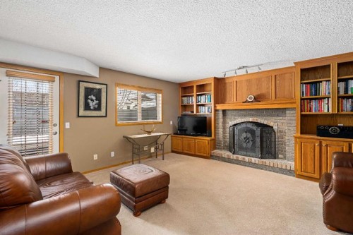 184 Sunmeadows Crescent Se, Calgary, AB - Indoor Photo Showing Living Room With Fireplace