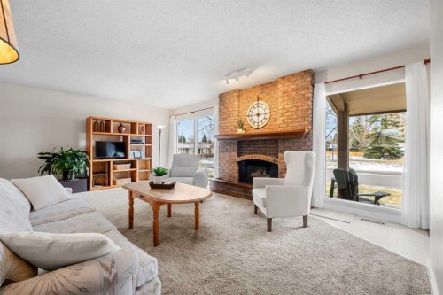247 Parkwood Close Se, Calgary, AB - Indoor Photo Showing Living Room With Fireplace