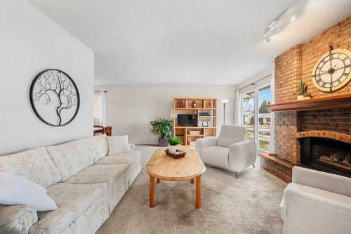 247 Parkwood Close Se, Calgary, AB - Indoor Photo Showing Living Room With Fireplace