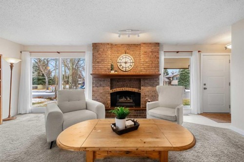 247 Parkwood Close Se, Calgary, AB - Indoor Photo Showing Living Room With Fireplace
