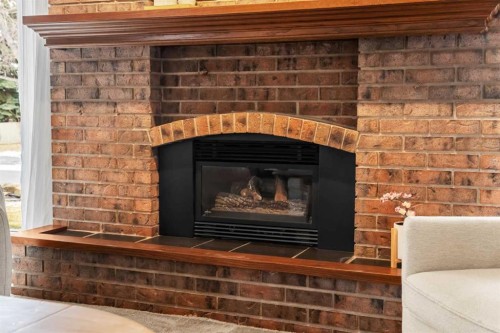247 Parkwood Close Se, Calgary, AB - Indoor Photo Showing Living Room With Fireplace