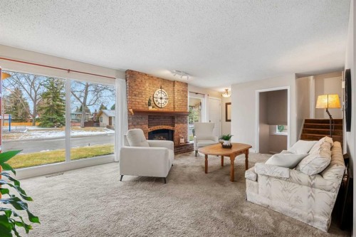 247 Parkwood Close Se, Calgary, AB - Indoor Photo Showing Living Room With Fireplace